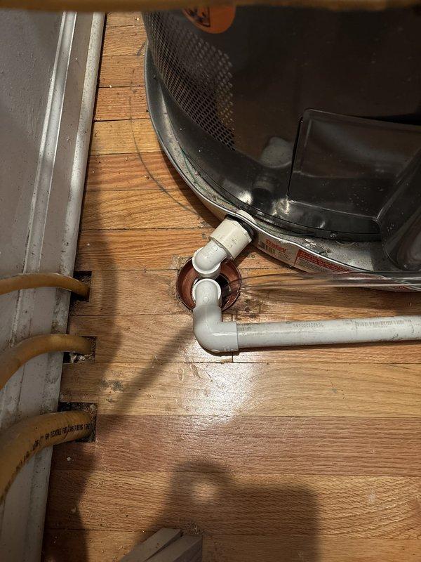Responded to utility room leak affecting unit below caused by clogged area floor drain overflow. Conducted comprehensive inspection of existing drainage configuration and identified multiple code and safety concerns requiring remediation. Primary issues include undersized area drain pipe inadequate for combined furnace and water heater discharge, drain pipe positioned below finish floor level without proper sealing, and improperly combined furnace and water heater pan drains requiring independent routing. Additional deficiencies noted include absence of water detection alarms, missing wet sensor cut-off switch on furnace, aging condensate neutralizer requiring replacement, lack of floor sealing in utility room, and water heater showing no evidence of routine maintenance. Provided detailed recommendations for corrective measures including drain line upsizing, proper floor penetration sealing, separation of condensate drain lines, installation of water alarms and safety switches, condens