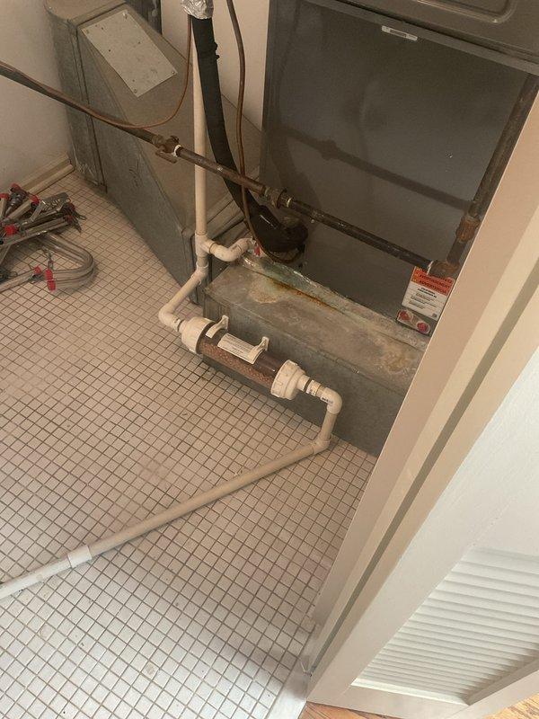 Completed VIP plumbing maintenance inspection of mechanical room containing tankless water heater, HVAC equipment, and associated plumbing systems. Documented existing conditions including copper supply lines, PVC drainage piping, and water heater connections. Part required for repair has been ordered and is currently in shop awaiting installation during follow-up service call.