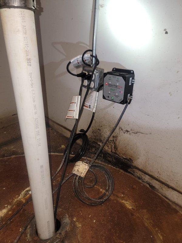 Conducted comprehensive site assessment of commercial building's plumbing infrastructure to provide estimate for annual maintenance services. Evaluated multiple vertical drain lines with PVC and black pipe configurations, inspected sump pump basin with corroded covers requiring cleaning, and assessed pump room electrical systems and discharge piping. Provided detailed quote for rodding and camera scoping of entire plumbing system, along with complete cleanout and maintenance of sewer basin and associated pump equipment.