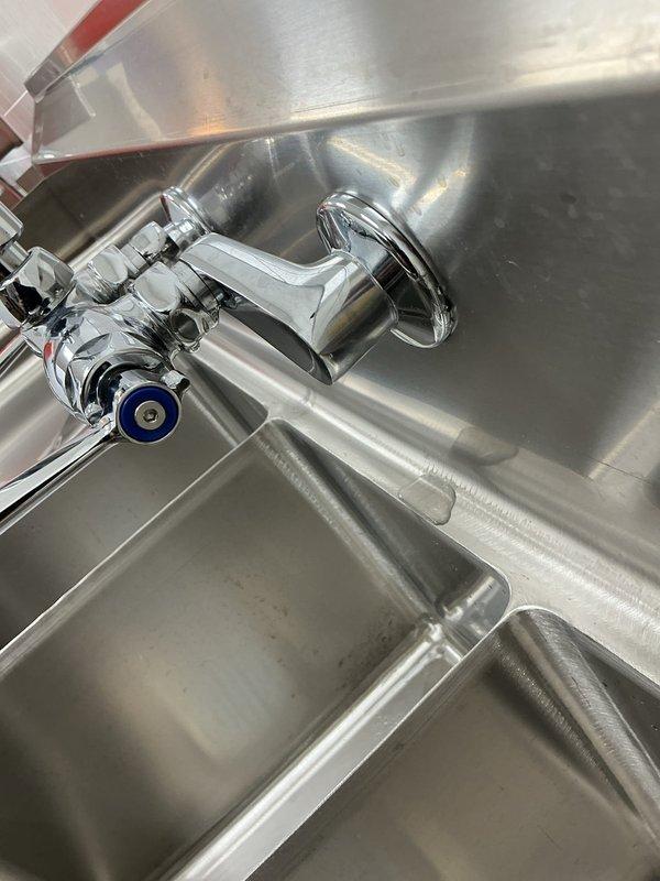 Responded to warranty callback for recently installed faucet experiencing swiveling issue. Upon inspection, identified loose mounting hardware on chrome faucet assembly installed on utility sink. Tightened mounting nuts and verified secure connection to sink deck, eliminating rotational movement. Tested faucet operation through full range of motion to confirm stable installation and proper function of both hot and cold water handles.
