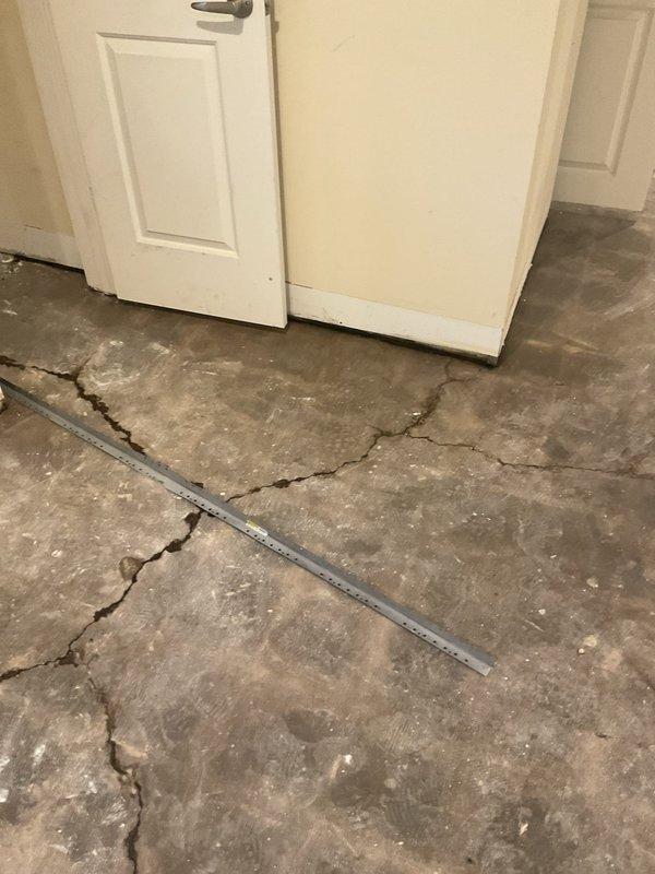 Responded to water intrusion issue where groundwater was entering through multiple foundation cracks in concrete floor. Upon arrival, documented extensive cracking patterns throughout the interior space, with water seeping up through fissures in the foundation slab. Previous drain tile installation had been completed, but continued water infiltration indicated need for additional assessment and estimate for comprehensive waterproofing solutions to address ongoing foundation water penetration.