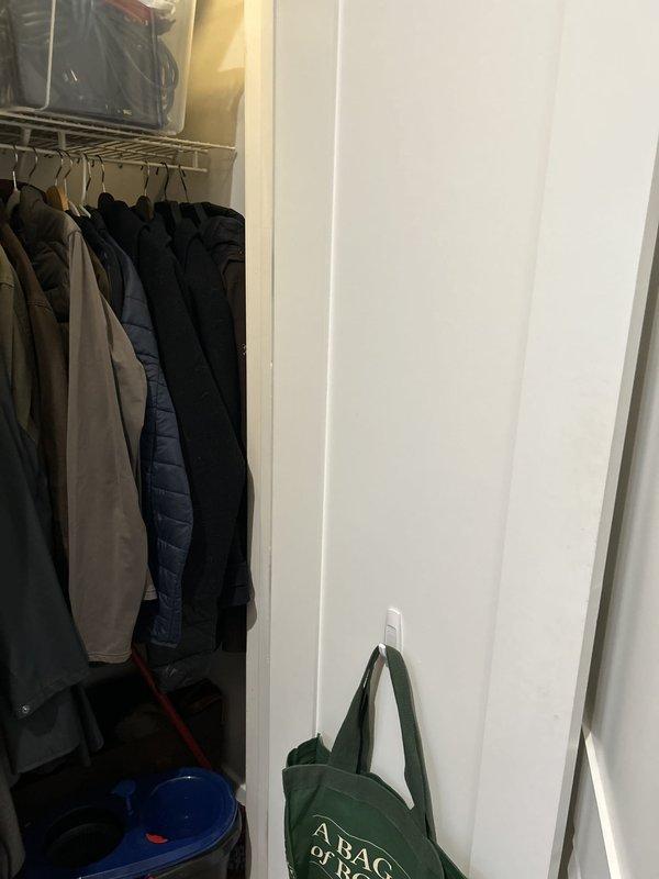 Responded to water leak service call in laundry/utility area. Upon inspection, identified potential leak source near washing machine location and placed collection container on closet floor as temporary measure to capture water. Customer requested return visit scheduled for Tuesday to complete permanent repair work.