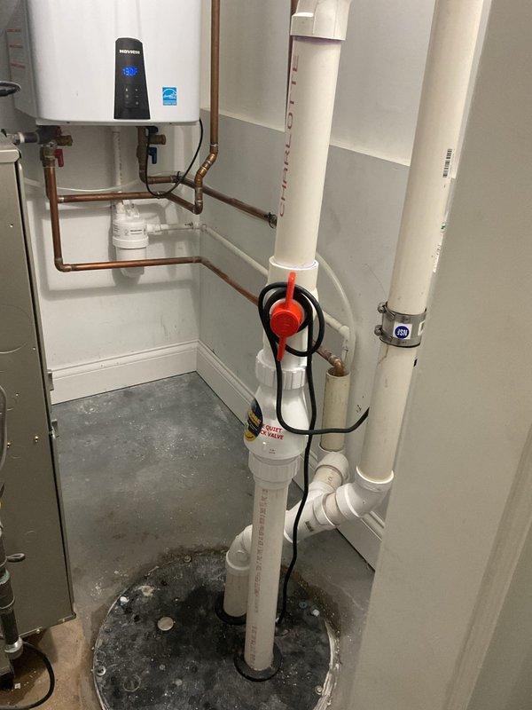 Responded to emergency flooding situation affecting entire residence. Upon arrival, diagnosed failed ejector pump system causing backup and water intrusion throughout property. Inspected mechanical room containing tankless water heater, sump pump assembly, and waste pump system with PVC drainage piping. Identified malfunctioning ejector pump unit with compromised float switch and discharge capabilities. Cleared standing water from affected areas and tested pump operation. Verified proper function of check valves, discharge piping, and electrical connections to pump system. Restored waste water removal capabilities and confirmed proper drainage flow through vertical waste stack. System returned to full operational status with no further flooding observed.