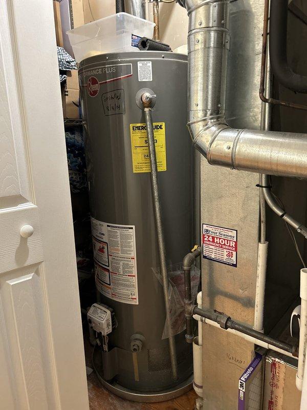 Performed comprehensive maintenance inspection on a Rheem tank-style water heater installed in 2014 located in the utility room. Evaluated the condition of the unit, associated plumbing connections including copper piping with brass fittings and shutoff valves, and adjacent HVAC ductwork system. Documented current operational status and configuration of all mechanical components to provide maintenance recommendations and estimate for any necessary repairs or replacement options.