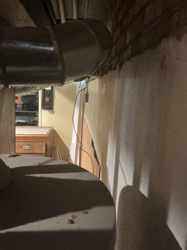 Completed residential drain and sewer estimate inspection in basement area. Assessed existing plumbing infrastructure, including exposed drainage lines and utility connections throughout the unfinished basement space. Documented current conditions of sewer system access points and photographed basement layout to provide comprehensive estimate for potential drain and sewer work.