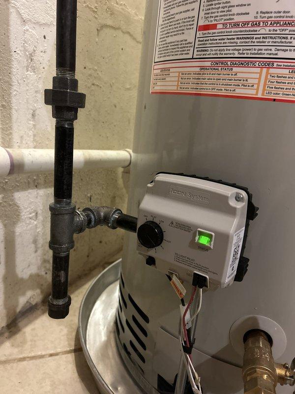 Responded to service call for leaking hot water heater in residential property. Upon inspection, identified active leak from aging tanked water heater system with deteriorated connections and compromised tank integrity. Assessed existing copper and steel piping configuration in basement installation area. Evaluated iCON System electronic control unit functionality and determined unit required replacement due to leak severity and age-related component failure. Completed water heater replacement with new tanked unit, reconnected existing plumbing lines, verified all connections for proper seal, tested system operation including temperature controls and safety features, and confirmed no active leaks present upon completion.