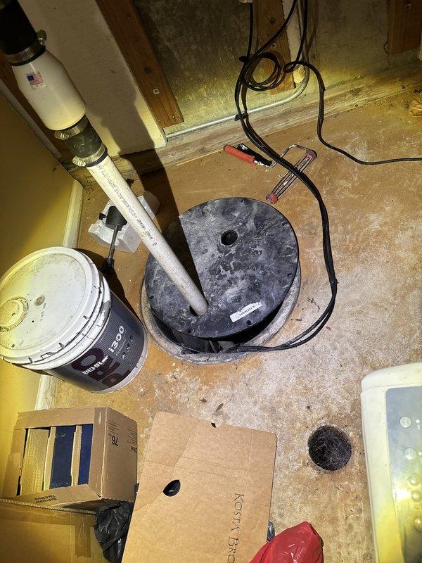 Responded to a basement water backup concern with suspected sewage involvement. Performed video camera inspection of the clogged back drain system to identify the blockage location and assess the condition of the underground drainage lines. Documentation captured the work area including the sump pump basin, utility room conditions, and laundry area where drainage issues were impacting the property.