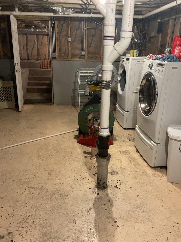 Responded to a slow-flushing first floor toilet following a recent main drain clearing. Rodded out approximately 10 feet of pipe to restore proper drainage and flow to the affected fixture. Documentation photos captured the basement plumbing system and work area for service records.
