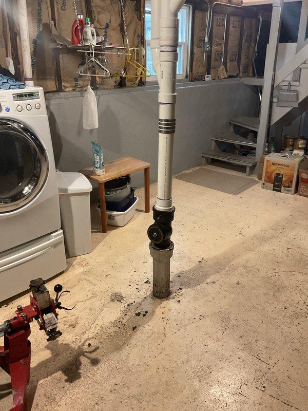 Responded to a slow-flushing first floor toilet following a recent main drain clearing. Rodded out approximately 10 feet of pipe to restore proper drainage and flow to the affected fixture. Documentation photos captured the basement plumbing system and work area for service records.