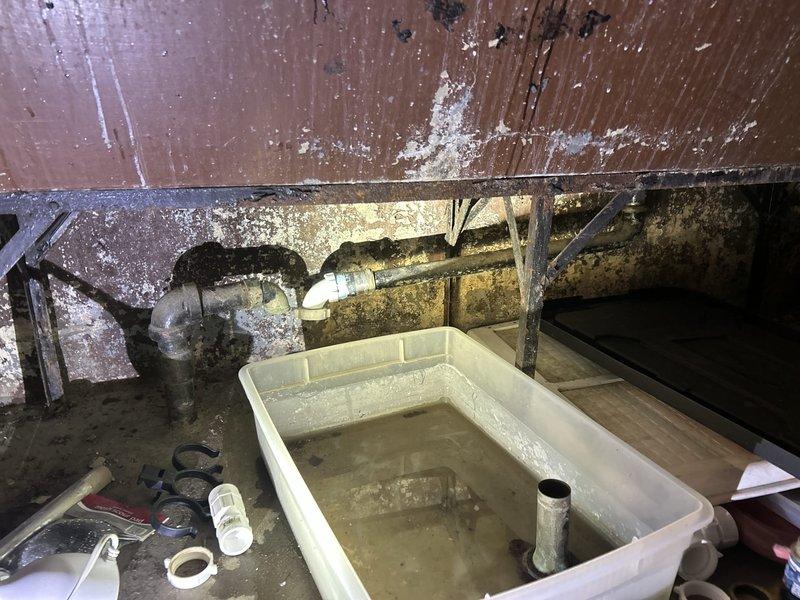 Responded to kitchen sink leak occurring after homeowner's attempted dishwasher installation. Upon inspection, accessed crawl space beneath kitchen to assess plumbing connections and identify source of leak. Found compromised water supply line connections and improper fitting installation related to recent dishwasher work. Replaced damaged supply line components, installed proper shut-off valves, and secured all connections to manufacturer specifications. Completed dishwasher installation with correct water supply hookup and drain line connection to existing plumbing system. Verified all connections for leaks, tested water flow and drainage, and confirmed proper operation of both kitchen sink and newly installed dishwasher. Placed catch pan beneath plumbing connections in crawl space as preventative measure. All systems tested and functioning properly with no active leaks detected upon completion.