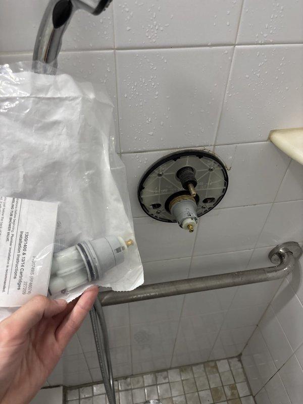 Replaced faulty shower valve cartridge in tiled shower enclosure. Building was shut down to complete the repair work. Removed existing trim plate to access the valve assembly, extracted the old cartridge, and installed new replacement cartridge with proper sealing to restore full temperature and volume control functionality to the shower system.