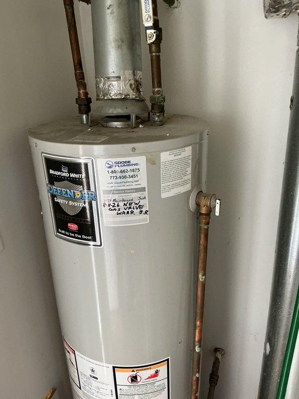 Responded to warranty service call for a 40-gallon Bradford White tanked water heater originally installed in 2021 that would not stay on. Performed diagnostic inspection of the unit, examined all connections, copper piping, brass fittings, and safety components of the Bradford White Defender Safety System. Documented the condition of the installation with photographs showing the water heater's current state, plumbing connections, and overall system functionality for warranty authorization and records.