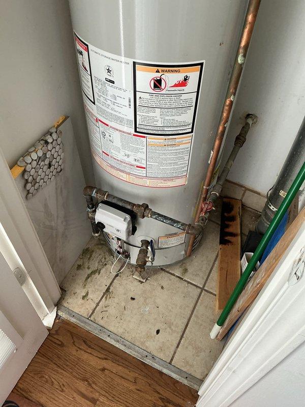 Responded to warranty service call for a 40-gallon Bradford White tanked water heater originally installed in 2021 that would not stay on. Performed diagnostic inspection of the unit, examined all connections, copper piping, brass fittings, and safety components of the Bradford White Defender Safety System. Documented the condition of the installation with photographs showing the water heater's current state, plumbing connections, and overall system functionality for warranty authorization and records.