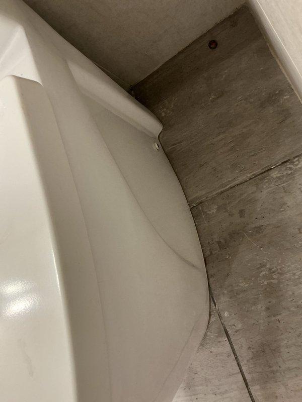 Responded to service call for leaking toilet in 10-year-old residential property. Upon arrival, contacted customer as requested and performed thorough inspection of bathroom fixtures. Diagnosed source of toilet leak at base connection point. Successfully reset toilet with new wax ring seal and closet bolts, ensuring proper alignment and secure mounting to floor flange. Verified bathtub installation and reset as needed per customer request. Tested all fixtures for proper operation and confirmed no active leaks. Documented completed work with photographs showing final installation condition and proper fixture placement.