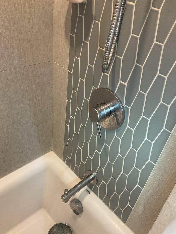 Responded to service call for multiple plumbing issues including toilet leaking from base during flushing, potential main line concerns in basement connected to PVC system, and persistent shower leak despite cartridge replacement on Hans Grohe fixture. Performed diagnostic inspection of toilet seal and wax ring integrity, assessed basement main line and PVC connections for potential repairs, and evaluated shower valve assembly to determine if alternative cartridge or additional valve component replacement required to resolve ongoing leak issue. Documented conditions with photos and provided estimates for recommended repairs to proceed with necessary work.