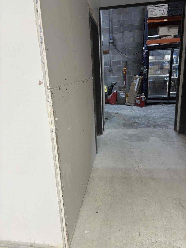 Responded to commercial facility for drain cleaning service in building under renovation. Deployed professional drain cleaning equipment with cable system to clear main line obstruction. Successfully restored proper drainage flow to affected area.