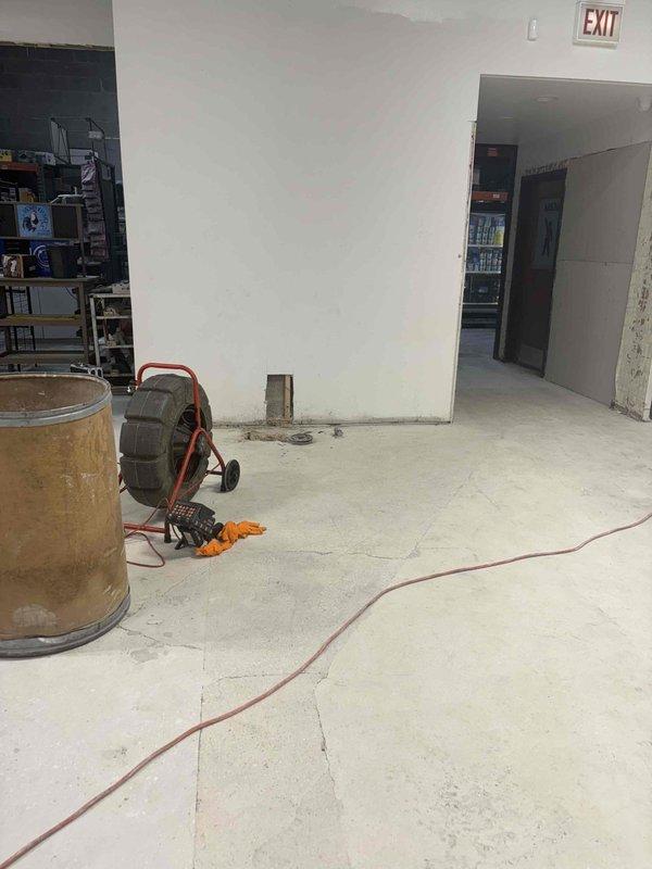 Responded to commercial facility for drain cleaning service in building under renovation. Deployed professional drain cleaning equipment with cable system to clear main line obstruction. Successfully restored proper drainage flow to affected area.