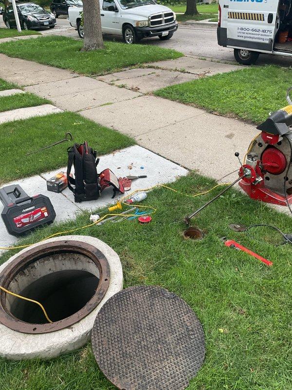 Performed annual maintenance on existing sewer backup system in century-old residence, confirming proper operation of all components. Conducted camera inspection of main sewer line from backup system to street connection to assess condition and check for root intrusion. Inspection revealed severely corroded metal piping with extensive rust deterioration, flaking, and pitting throughout the fitting assembly, indicating advanced age and moisture exposure. Accessed main line through exterior cleanout, documenting pipe condition with photographic evidence showing compromised structural integrity of metal components and potential failure points requiring future attention.