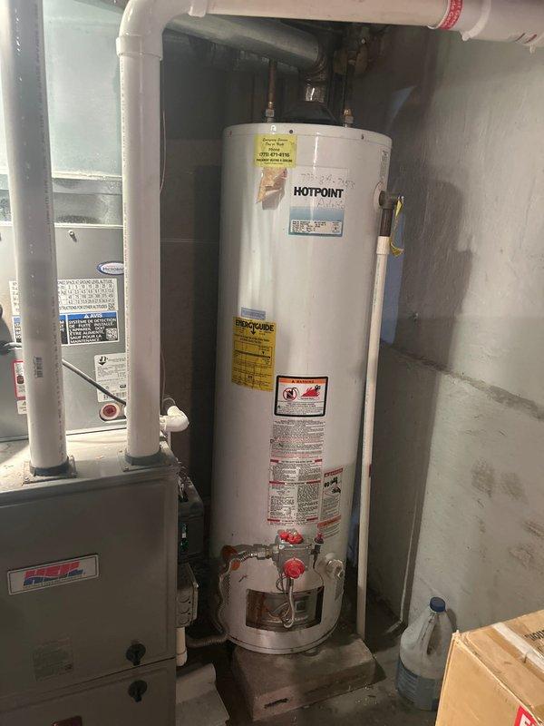 Conducted on-site evaluation for tankless water heater installation to replace existing Hotpoint conventional tank water heater. Assessed current plumbing configuration including copper supply lines, galvanized piping connections, gas line accessibility, and existing venting system with PVC exhaust components. Documented mechanical room layout, available clearances, and electrical requirements to provide comprehensive estimate for tankless conversion including necessary upgrades to gas supply piping, water lines, venting modifications, and electrical service.