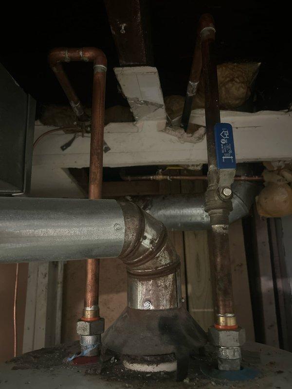 Conducted on-site evaluation for tankless water heater installation to replace existing Hotpoint conventional tank water heater. Assessed current plumbing configuration including copper supply lines, galvanized piping connections, gas line accessibility, and existing venting system with PVC exhaust components. Documented mechanical room layout, available clearances, and electrical requirements to provide comprehensive estimate for tankless conversion including necessary upgrades to gas supply piping, water lines, venting modifications, and electrical service.