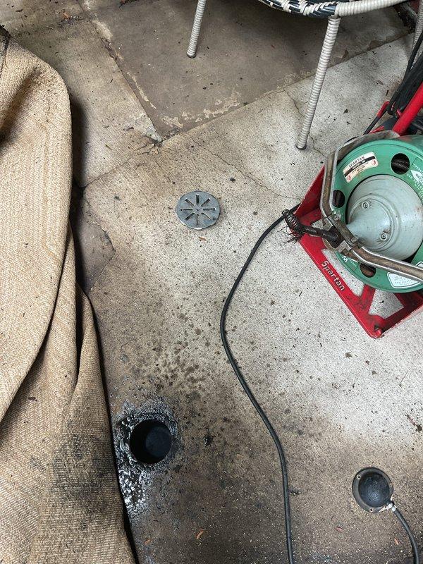Responded to service call for two clogged underground drains at residential property. Successfully cleared both drain lines extending approximately 80 feet below ground level using professional drain cleaning equipment. Accessed drain lines through outdoor patio area, protected surrounding surfaces and furnishings during service, and confirmed proper water flow restoration upon completion.