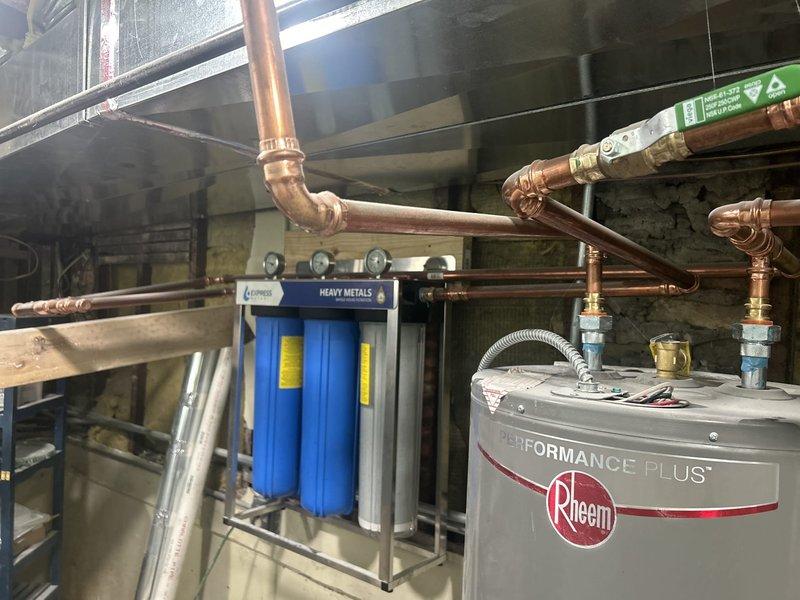 Responded to intermittent low water pressure complaint with pressure fluctuations observed on existing home filter gauge. Per municipal water authority request, installed pressure gauge at main water entry point to monitor and document pressure variations for utility company investigation. Inspected plumbing system including water heater connections, copper supply lines, and whole-house filtration system to rule out internal restrictions or equipment-related causes of pressure loss.