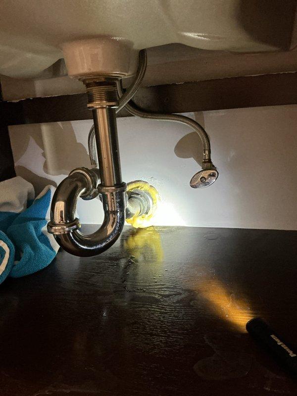 Replaced deteriorated bathroom sink faucet assembly due to rust and corrosion. Disconnected existing water supply lines, removed old faucet fixture, installed new faucet with updated drain assembly and P-trap connections, verified proper water flow and drainage, and confirmed no leaks at all connection points.
