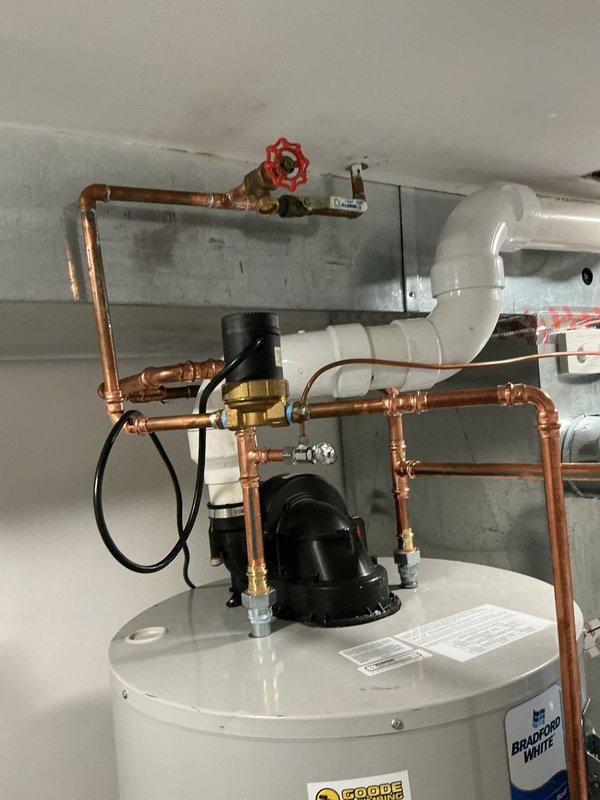 Responded to customer concern regarding banging pipes following recent water heater installation. Upon investigation, identified water hammer issue caused by rapid valve closure in the domestic hot water system. Inspected the complete installation including the water heater, recirculation pump assembly, copper supply lines, pressure relief valve, and associated fittings. Verified all connections were properly secured and soldered joints were sound. Evaluated the expansion tank mounting and pressure settings to ensure proper system operation. Confirmed the recirculation pump was functioning correctly and all shut-off valves were operating smoothly. The copper piping configuration and support brackets were examined to identify potential vibration points. Addressed the water hammer condition to eliminate the banging noise and ensure quiet system operation. All components tested and verified to be working within normal parameters upon completion.