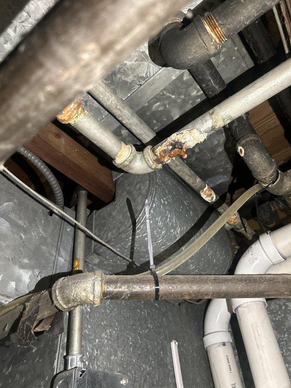Completed installation of residential gas-fired tanked water heater with proper venting and gas line connections. Installed new unit with temperature/pressure relief valve, gas control assembly, and copper supply piping in utility space with existing corroded infrastructure. All connections tested and verified operational per manufacturer specifications.