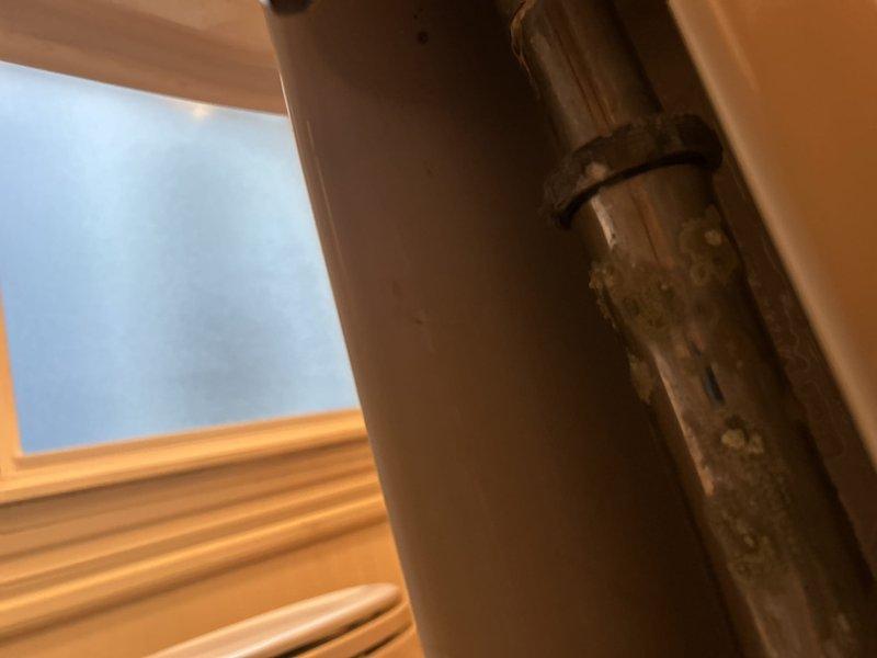 Responded to report of leak on underside of pedestal sink faucet in first floor bathroom. Performed thorough inspection of faucet assembly, supply lines, and drain connections to locate source of water leak. Assessed condition of fixtures and plumbing components, documented findings with photographs, and provided recommendations for repair options to resolve the leaking faucet issue.