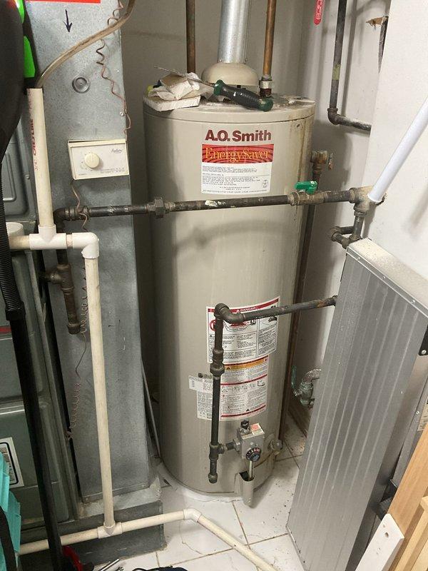 Responded to commercial service call for reported leak potentially caused by clogged drain line. Upon inspection, assessed water heater installation area and surrounding plumbing systems, including copper supply lines, pressure relief components, and drain connections. Documented existing conditions of plumbing infrastructure, including shut-off valves, pressure gauges, and drainage pathways to identify source of reported leak and determine if drain blockage was contributing factor.