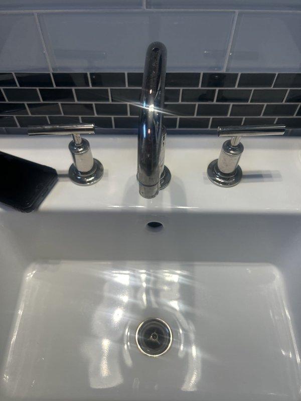 Responded to service call for multiple bathroom fixture repairs. Addressed toilet tank that was not filling properly by inspecting and servicing the fill valve assembly and float mechanism. Repaired malfunctioning toilet handle on second toilet to restore proper flushing operation. Completed necessary repairs to bathroom sink faucet assembly, ensuring proper water flow and operation of the three-piece chrome fixture with center spout and dual handles. All fixtures tested and confirmed operational upon completion.