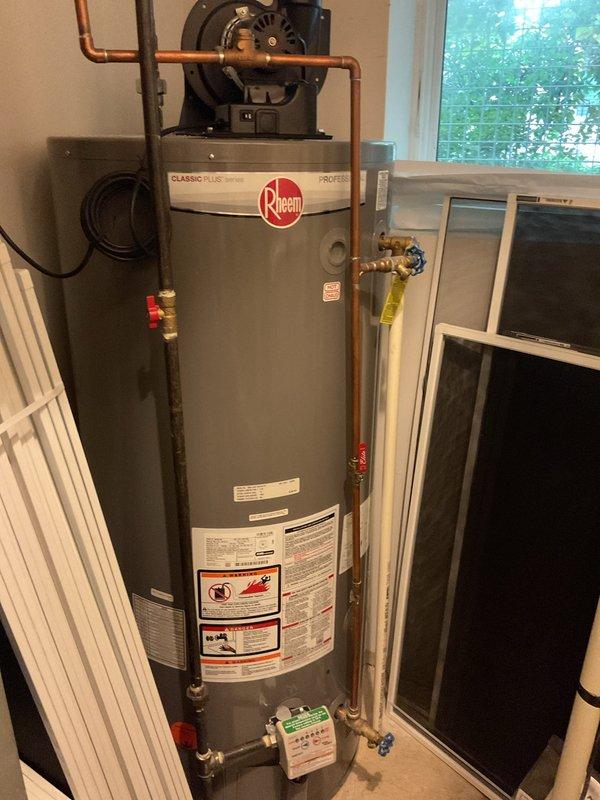 Performed routine maintenance flush on Rheem Classic Plus Series tanked water heater in 10-year-old residential property with no prior service history. Drained sediment buildup from tank bottom, flushed system until water ran clear, and inspected all copper supply lines, pressure relief valve, and recirculation pump assembly for proper operation. Unit returned to normal service with no issues identified.