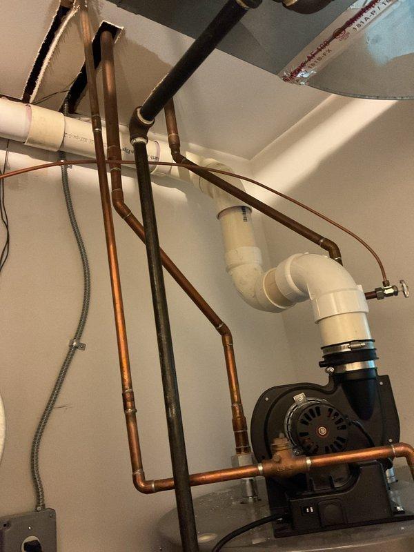 Performed routine maintenance flush on Rheem Classic Plus Series tanked water heater in 10-year-old residential property with no prior service history. Drained sediment buildup from tank bottom, flushed system until water ran clear, and inspected all copper supply lines, pressure relief valve, and recirculation pump assembly for proper operation. Unit returned to normal service with no issues identified.