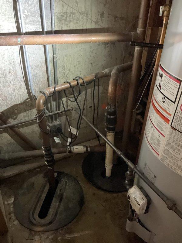 # Sump Pump Service Call

Responded to a non-operational sump pump in residential basement. Upon arrival, conducted diagnostic assessment of the 2-year-old sump pump unit that had ceased functioning. Performed thorough inspection of the pump assembly, float switch mechanism, discharge piping, and electrical connections to identify failure points.

Examined the basement utility area where the sump pump system is installed, noting the existing plumbing infrastructure including copper supply lines, water heater connections, and drainage systems. Documented current conditions of the mechanical room with photographic evidence showing the overall plumbing configuration, pipe routing, and equipment layout.

Assessed the sump pump's operational status by testing power supply, verifying circuit integrity, and examining the pump motor for signs of mechanical failure or electrical issues. Inspected the sump basin for debris accumulation, proper float operation, and adequate water level control fu