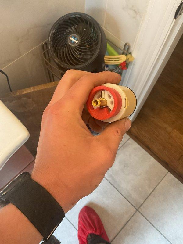Responded to callback for ongoing leak in shower area. Upon arrival, performed pressure testing of shower valve assembly using diagnostic gauges to identify source of continued water intrusion. Inspected wall-mounted shower arm connection and escutcheon plate where previous repair work had been completed. Documented existing conditions including residual mounting marks and access panel to valve body. Testing revealed persistent leak requiring further investigation of internal valve components or supply line connections behind wall access point.