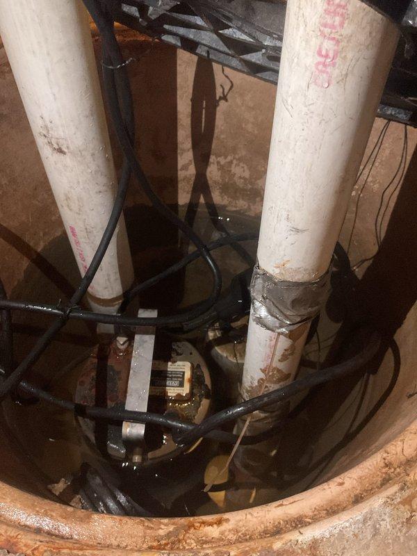 Responded to service call for non-functioning sump pump system. Upon inspection, identified that the float switch was stuck in the down position, preventing the pump from activating. Freed the stuck float mechanism and verified proper movement throughout its full range of travel. Tested pump operation through multiple cycles to confirm automatic activation and deactivation at appropriate water levels. Inspected discharge piping, check valves, and electrical connections for proper operation. System restored to full working order with float switch functioning correctly.
