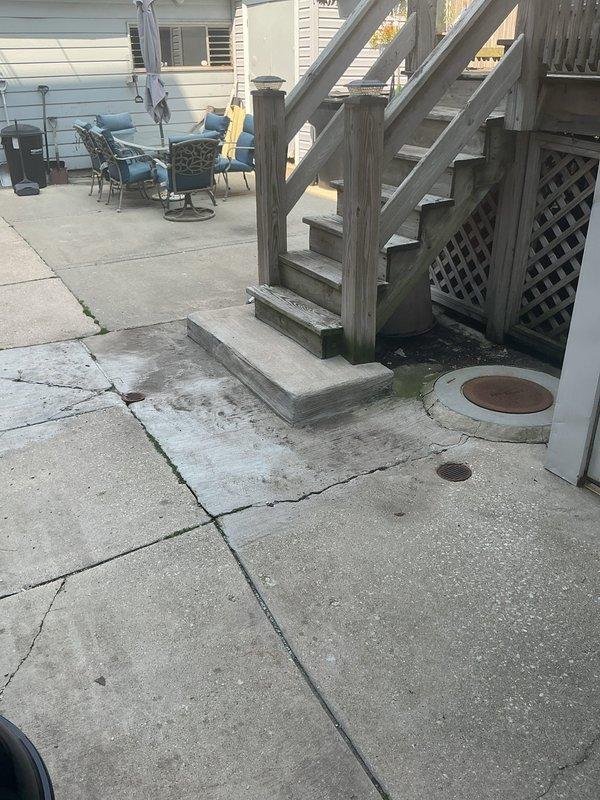 Completed sump pit inspection and repair at residential property. Assessed deteriorated sump pit with standing water, foam accumulation, and corroded pipe fittings. Addressed drainage issues affecting outdoor concrete patio area adjacent to wooden staircase structure. Customer payment received in full upon completion of sold repair work.