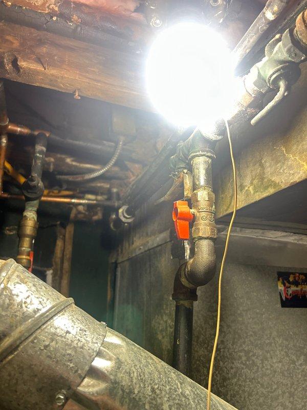 Performed comprehensive gas pressure test from meter throughout residential gas piping system in mechanical room following customer-arranged leak repair above water heater. Conducted thorough inspection of all exposed gas lines, connections, and fittings including supply lines to Rheem water heater and Goodman furnace. Verified system integrity and confirmed all connections hold proper pressure with no detectable leaks, meeting requirements for utility company reconnection approval.