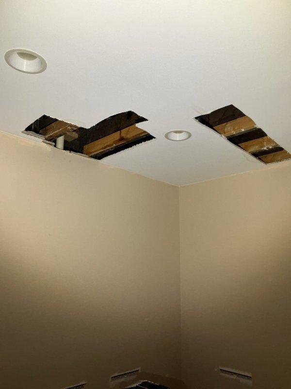 Responded to call back request for potential vent stack issues. Accessed and inspected plumbing vent stack system through ceiling access points in kitchen area. Documented current conditions with photographs showing ceiling openings and exposed framing for assessment purposes. Scheduled Quality Assurance Specialist visit for Monday morning time slot to provide detailed estimates for vent stack replacement work.