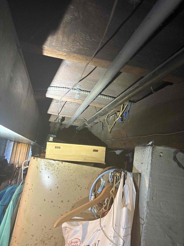 Responded to gas leak emergency call at residential property where gas service had been shut off as a safety precaution. Performed comprehensive inspection of basement utility area, focusing on gas piping connections to water heater and associated gas appliances. Conducted visual examination of copper gas lines, fittings, and connections throughout the mechanical room. Documented existing conditions with photographs showing water heater installation, overhead piping infrastructure, and basement utility configuration for service records and future reference.