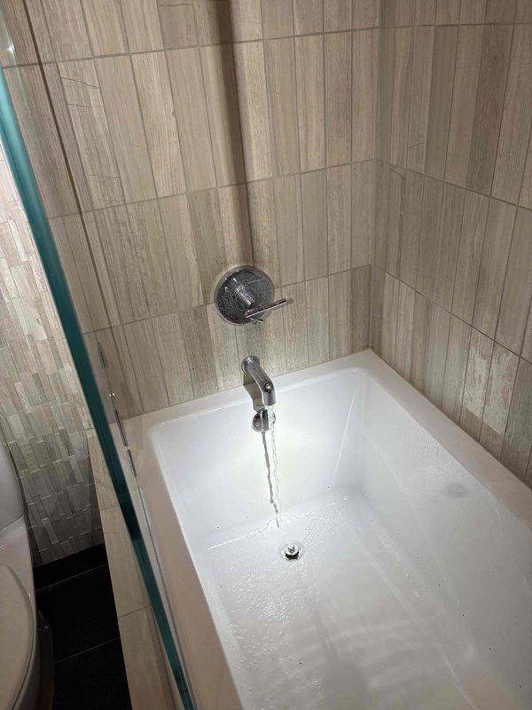 Responded to service call for inspection of two toilets exhibiting persistent sewer odor, drain fly infestation, and abnormally low water levels in bowls. Conducted thorough diagnostic assessment of both fixtures to identify source of sewer gas infiltration and determine cause of reduced water levels. Inspected wax ring seals, flange connections, vent stack functionality, and trap configurations to isolate deficiencies allowing methane gases and pest entry into living space.