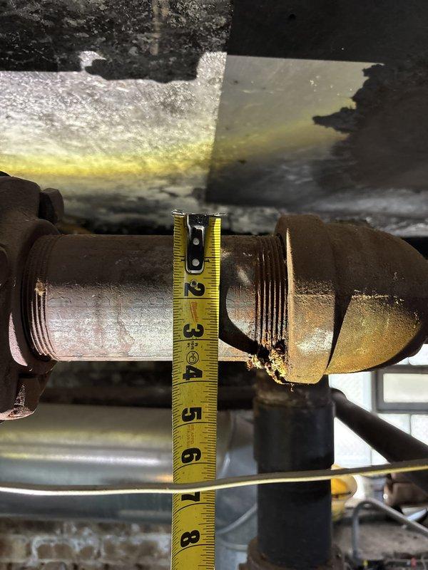 Responded to emergency call for leaking heating pipes in basement mechanical room. Upon inspection, identified corroded threaded pipe fittings and couplings on the heating system manifold with active water seepage at multiple connection points. Replaced deteriorated galvanized steel pipe sections and fittings, installed new threaded couplings, and pressure-tested all connections to ensure proper seal and system integrity. All leaks resolved and heating system restored to full operational status.