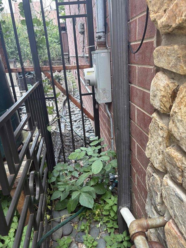 Conducted on-site assessment for conversion from dual electric tankless water heaters to single gas tankless unit in 15-year-old residential property. Evaluated existing electrical infrastructure including conduit and meter box mounted on exterior brick wall, documented current mechanical closet configuration housing HVAC equipment and utility access points. Provided comprehensive estimate for gas line installation, venting requirements, electrical modifications, and removal of existing electric tankless systems to facilitate upgrade to gas-fired tankless water heater system.