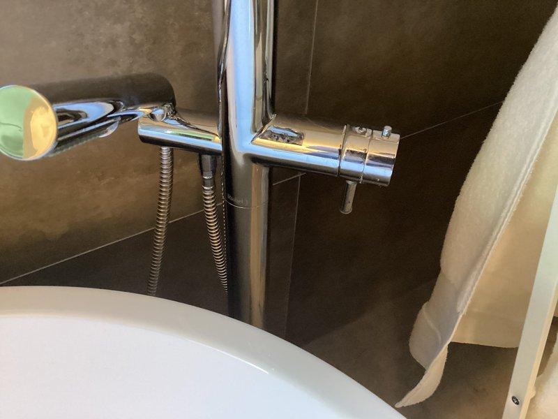 Responded to plumbing repair call addressing multiple fixture issues. Serviced Toto toilet that was continuously running due to faulty fill valve mechanism, replaced internal components and adjusted water level to manufacturer specifications. Inspected and repaired dripping tub faucet and shower handle for Riobel and Hans Grohe fixtures, replaced worn cartridge seals and O-rings to eliminate leaks. All fixtures tested and confirmed operational with no further water flow issues detected.