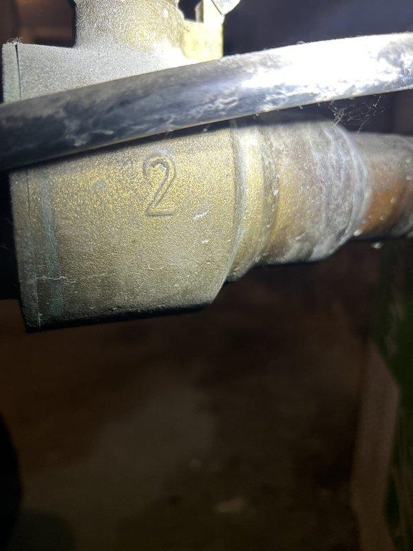 Responded to basement water leak investigation. Located active leak on insulated copper piping system showing significant moisture accumulation and condensation on foam pipe insulation. Identified compromised pipe sections with visible corrosion, oxidation, and patina on copper fittings and connections. Documented aged plumbing infrastructure including corroded elbow joints, deteriorated metal clamps, and threaded valve connections displaying environmental wear. Photographed affected areas showing water droplets and wet patches on insulation material. Provided estimate for necessary repairs to address leak source and damaged components.