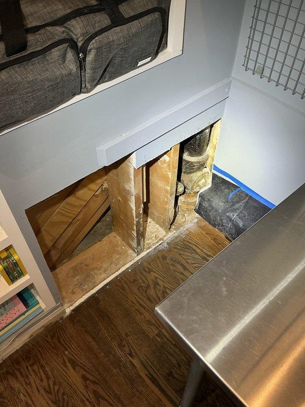 Inspected leaking 4" cast iron toilet stack and identified a crack running down the backside of the cleanout tee at the bottom of the stack. Recommended replacement of the damaged cleanout tee to resolve the leak. Homeowner opened walls on both sides of the toilet stack to provide access for repair work.

Secured and strapped the toilet stack prior to removing components to ensure structural stability during the repair process. Removed the existing 4" cast iron cleanout tee along with the damaged section of 4" cast iron toilet stack. Installed new 4" cast iron cleanout tee and replacement section of 4" cast iron toilet stack to restore proper function and eliminate the leak. Power rodded the sewer line from the stack cleanout after completing the installation to ensure clear drainage and proper flow. Work completed with 1-year warranty on parts and lifetime workmanship warranty.
