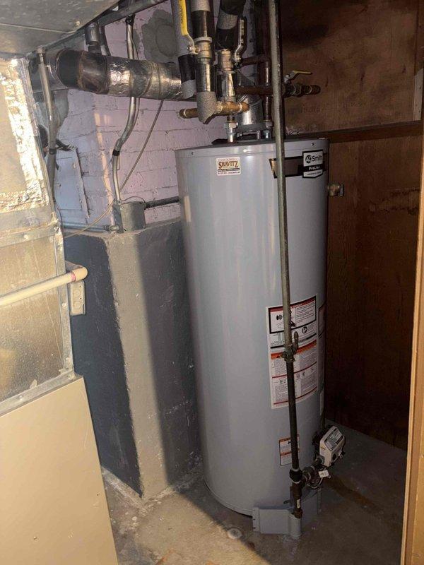 Responded to service call for pilot light repeatedly extinguishing on residential tanked water heater in older home. Upon inspection, found Smith-branded water heater unit installed in basement utility area with copper supply lines and standard venting configuration. Diagnosed pilot assembly malfunction causing intermittent flame failure. Cleaned thermocouple, tested gas valve operation, and verified proper draft through flue system to ensure safe and reliable pilot operation going forward.