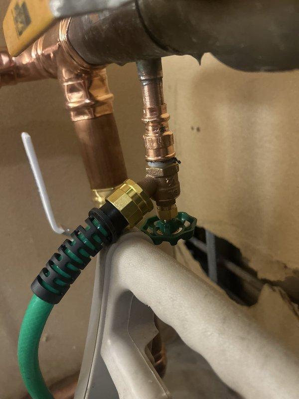 Completed building shutdown and plumbing repair work on water heater connections and associated piping. Replaced deteriorated flexible water supply lines, installed new brass fittings and shut-off valves with color-coded handles for easy identification, and re-soldered copper pipe joints to ensure leak-free connections. All work was completed with building systems secured and verified operational upon completion.