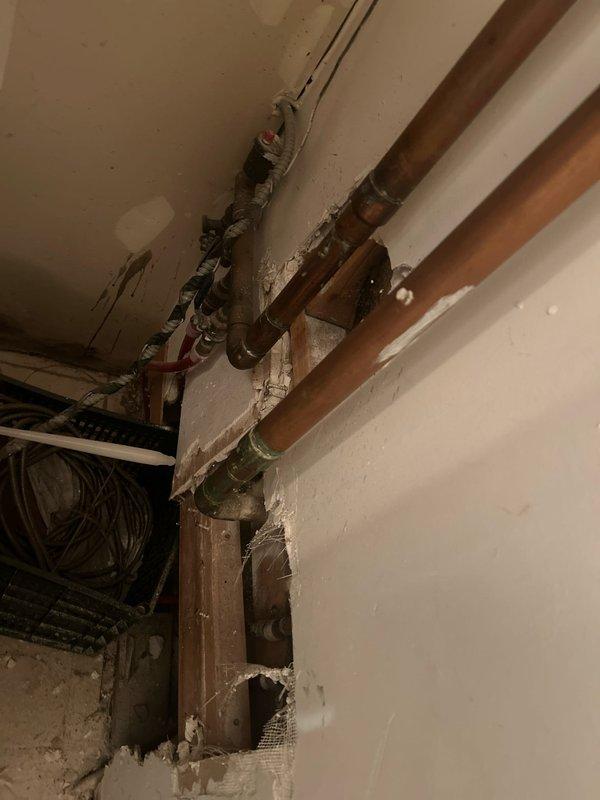 Performed routine maintenance flush on tankless water heater system as part of scheduled membership service. Inspected plumbing infrastructure including copper supply lines, valve assemblies, and connections throughout the utility area, noting normal aging and patina on older copper piping with all components functioning properly. Completed comprehensive plumbing inspection of residential fixtures and confirmed all systems operating within normal parameters.